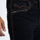 Close-up of black jeans on the pocket front