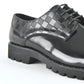 Black leather lace-up dress shoes for men close up