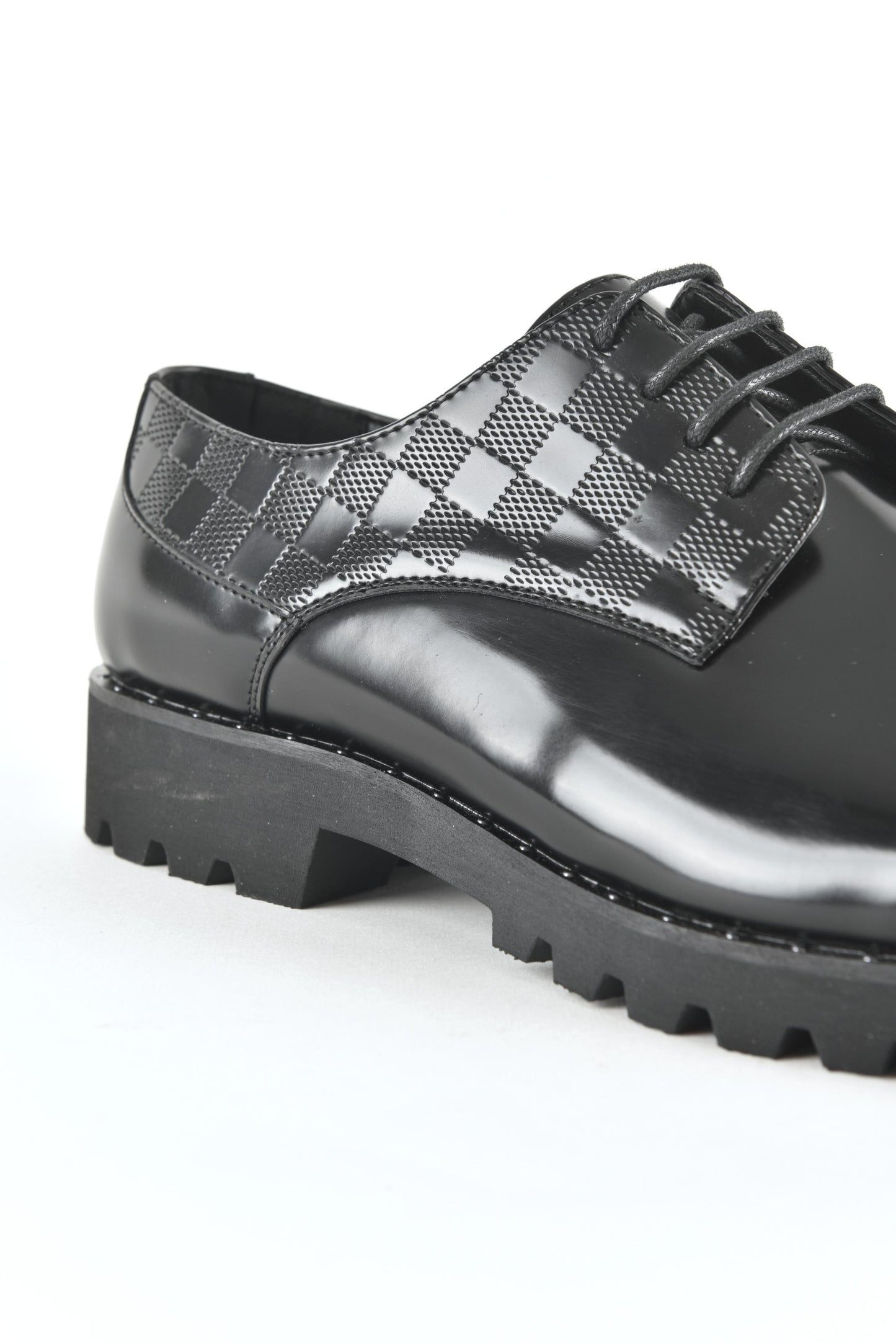 Black leather lace-up dress shoes for men close up