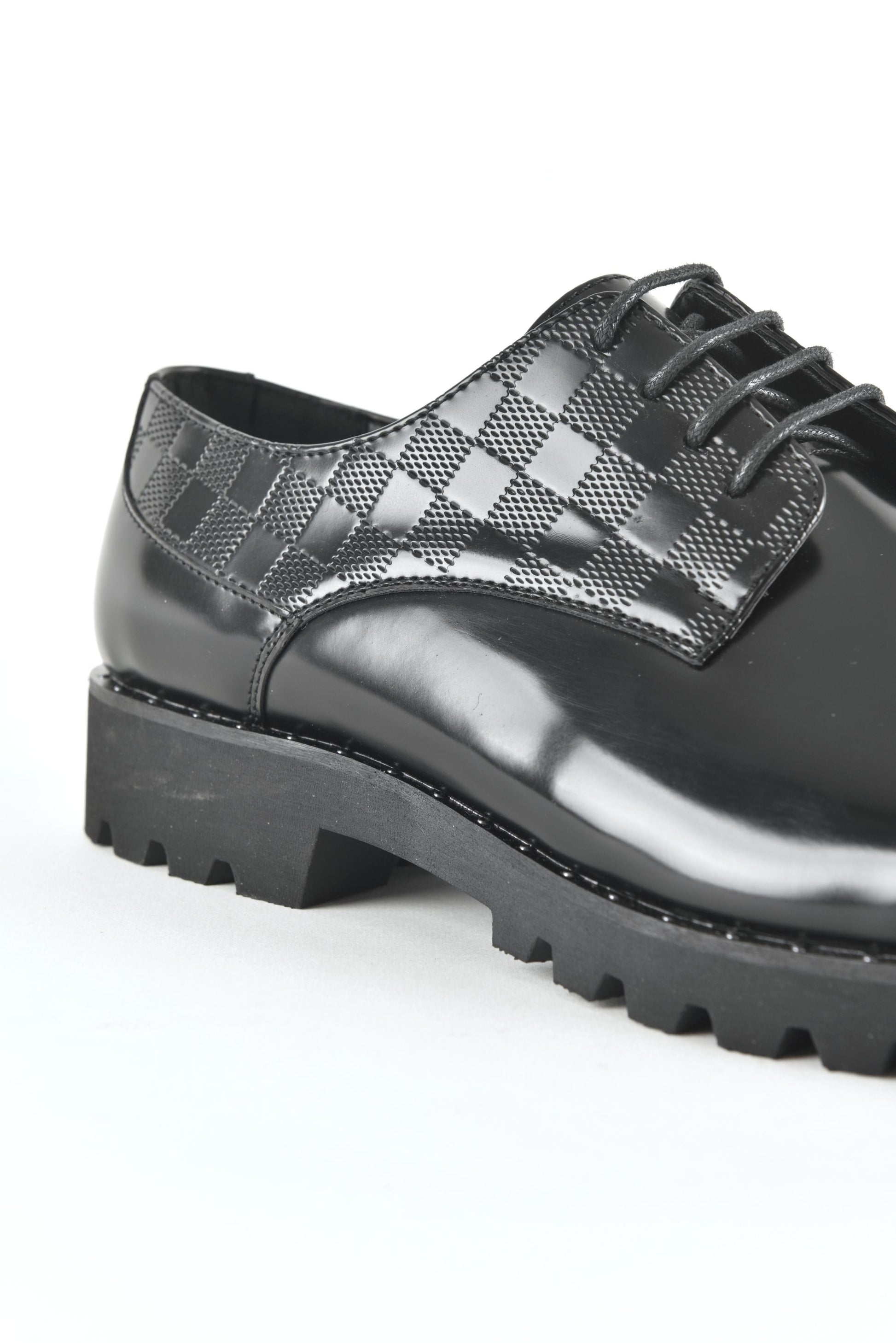 Black leather lace-up dress shoes for men close up