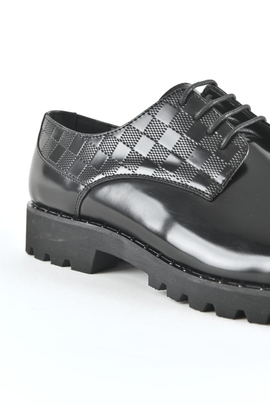 Black leather lace-up dress shoes for men close up
