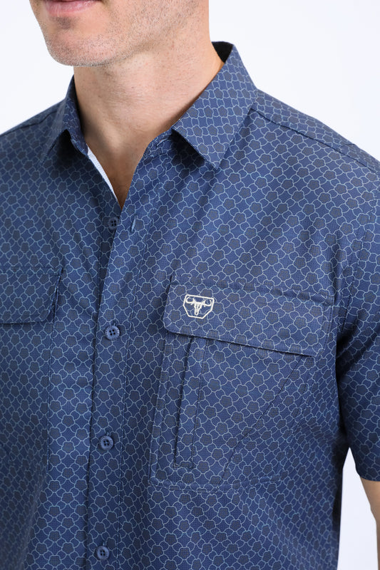 Man wearing a navy western aztec performance shirt close up front