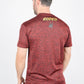 A man viewed from the back wearing a heathered red t-shirt with 'RODEO' and a horse logo printed in yellow on the upper back, paired with blue jeans against a white studio background.