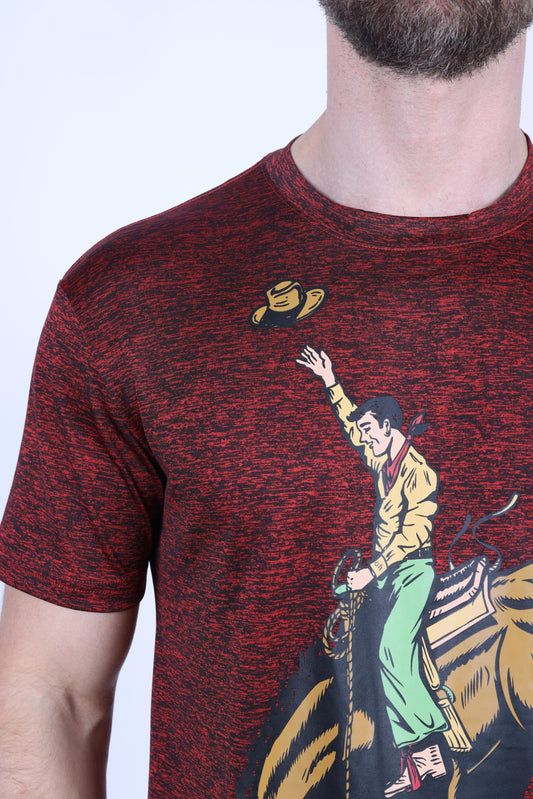 A close-up of a man wearing a short-sleeve crewneck t-shirt with a red and black heathered texture. The shirt features a graphic print of a cowboy riding a bucking bronco, with a yellow hat flying off.