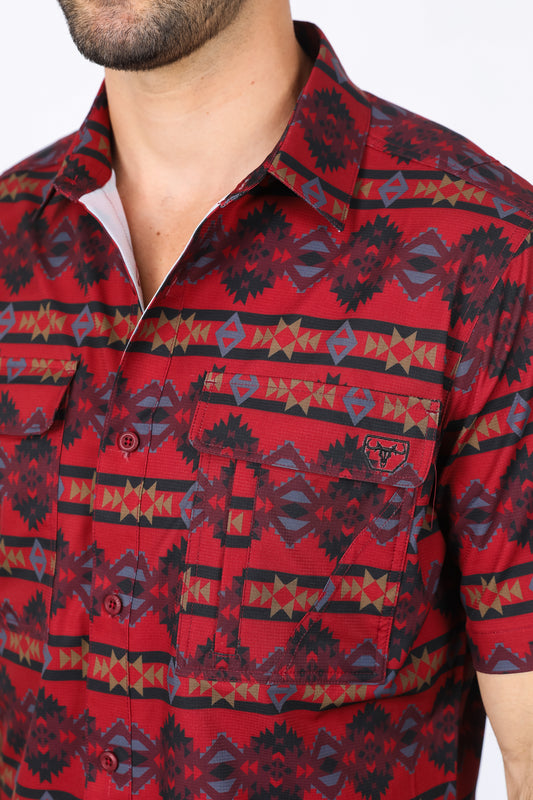 Man wearing a red western aztec performance shirt close up front