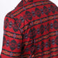 Man wearing a red western aztec performance shirt close up back