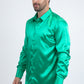 Man wearing a green satin shirt on a white background