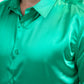 Green satin shirt worn by a person on a white background