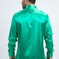 Man wearing a green satin shirt on a white background