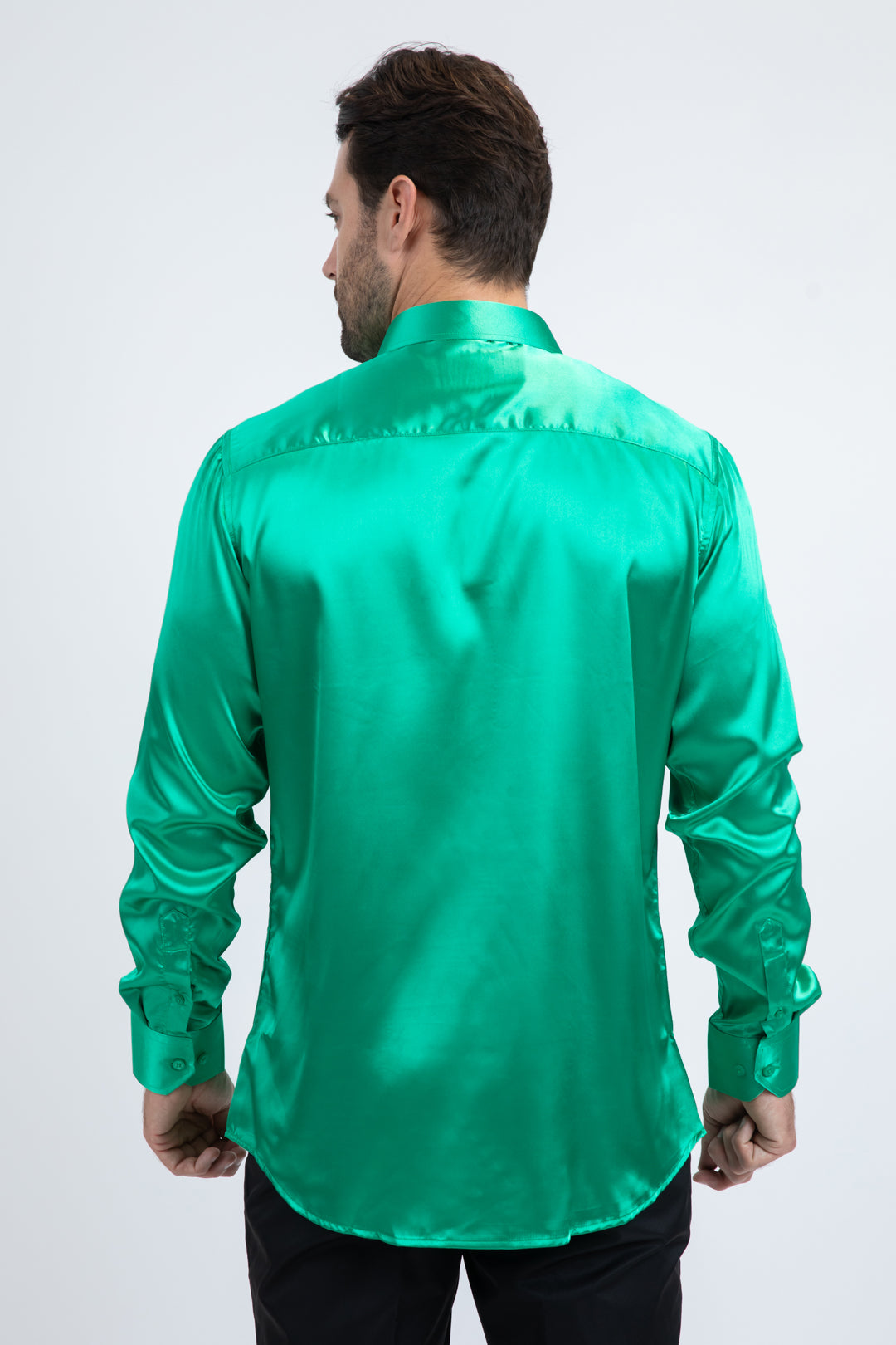 Man wearing a green satin shirt on a white background
