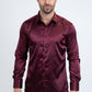 Man wearing a burgundy satin shirt on a white background