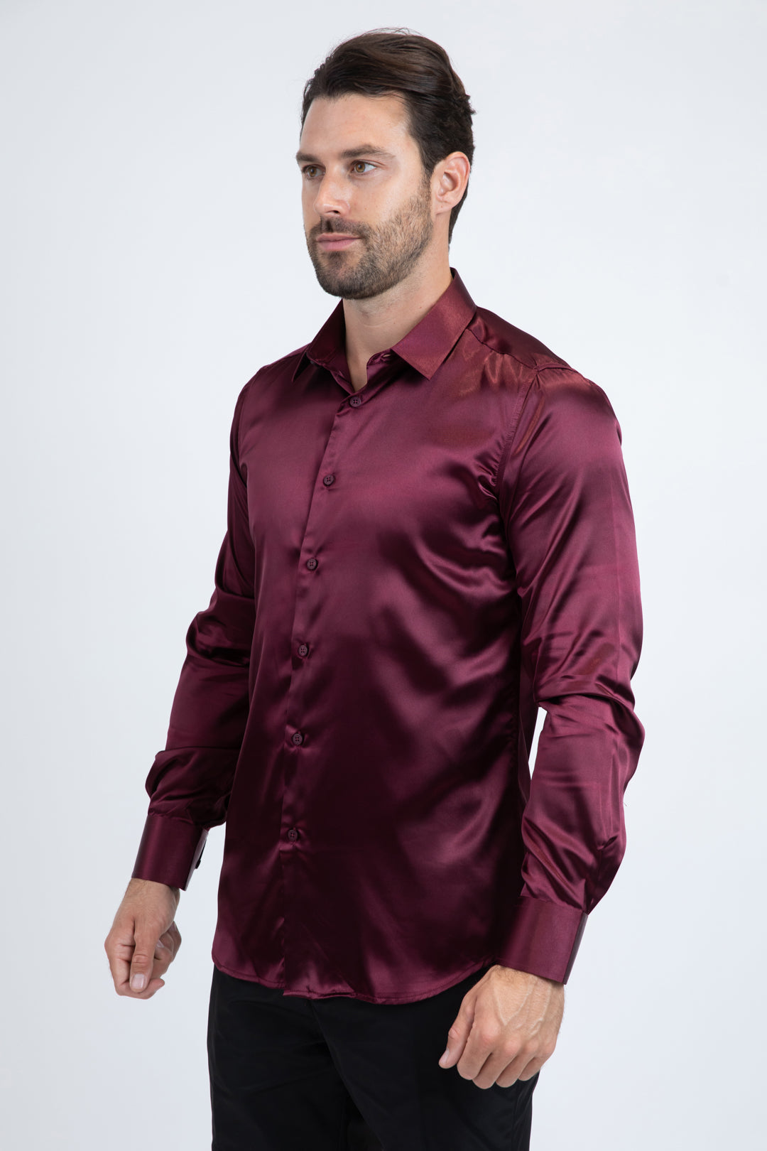 Man wearing a burgundy satin shirt on a white background