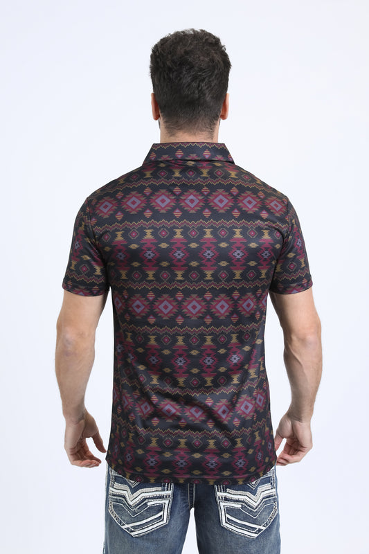 Man wearing a patterned shirt and jeans on a white background