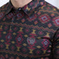 Close-up of a patterned shirt with a visible brand logo.
